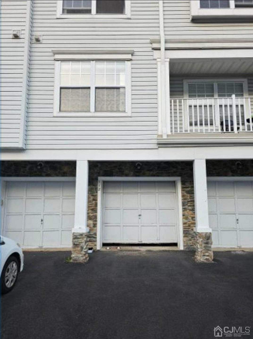 112 Prestwick Way Edison, NJ 08820 - Photo 3 of 24 a front view of a house with a garage