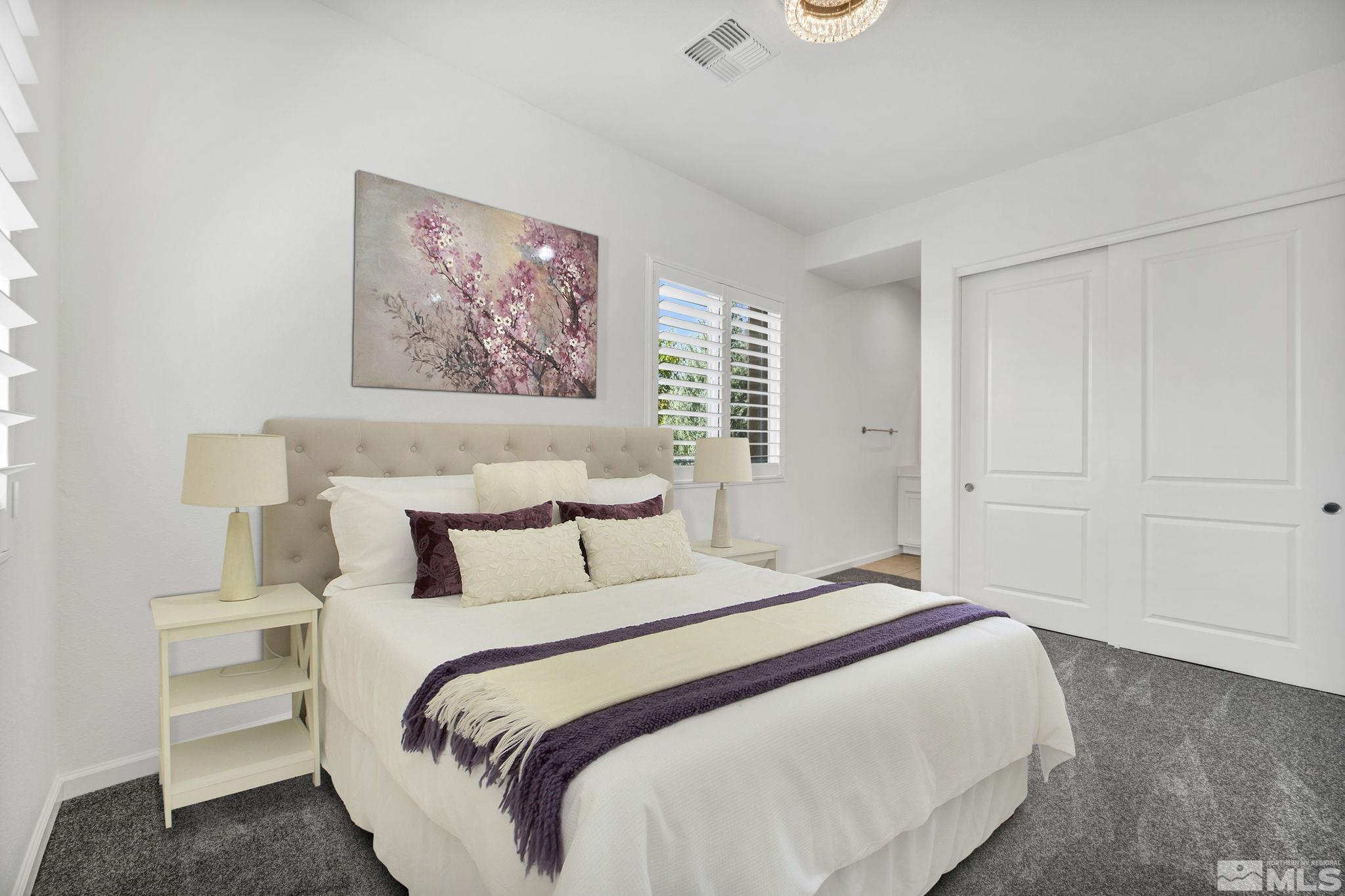 2013 Neviekay Lane Reno, NV 89521 - Photo 12 of 35 a bedroom with bed and paintings on the wall