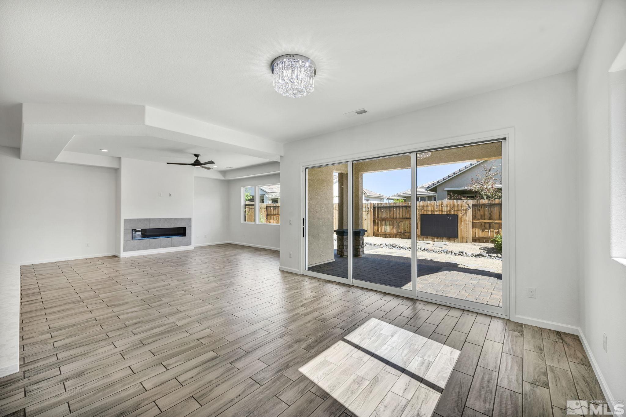 2013 Neviekay Lane Reno, NV 89521 - Photo 20 of 35 an empty room with wooden floor and windows
