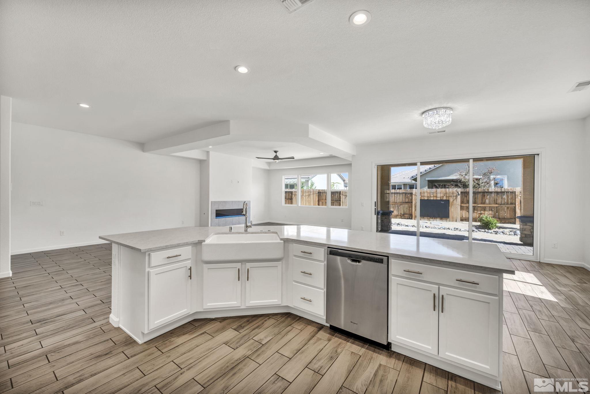 2013 Neviekay Lane Reno, NV 89521 - Photo 22 of 35 a kitchen with white cabinets and sink