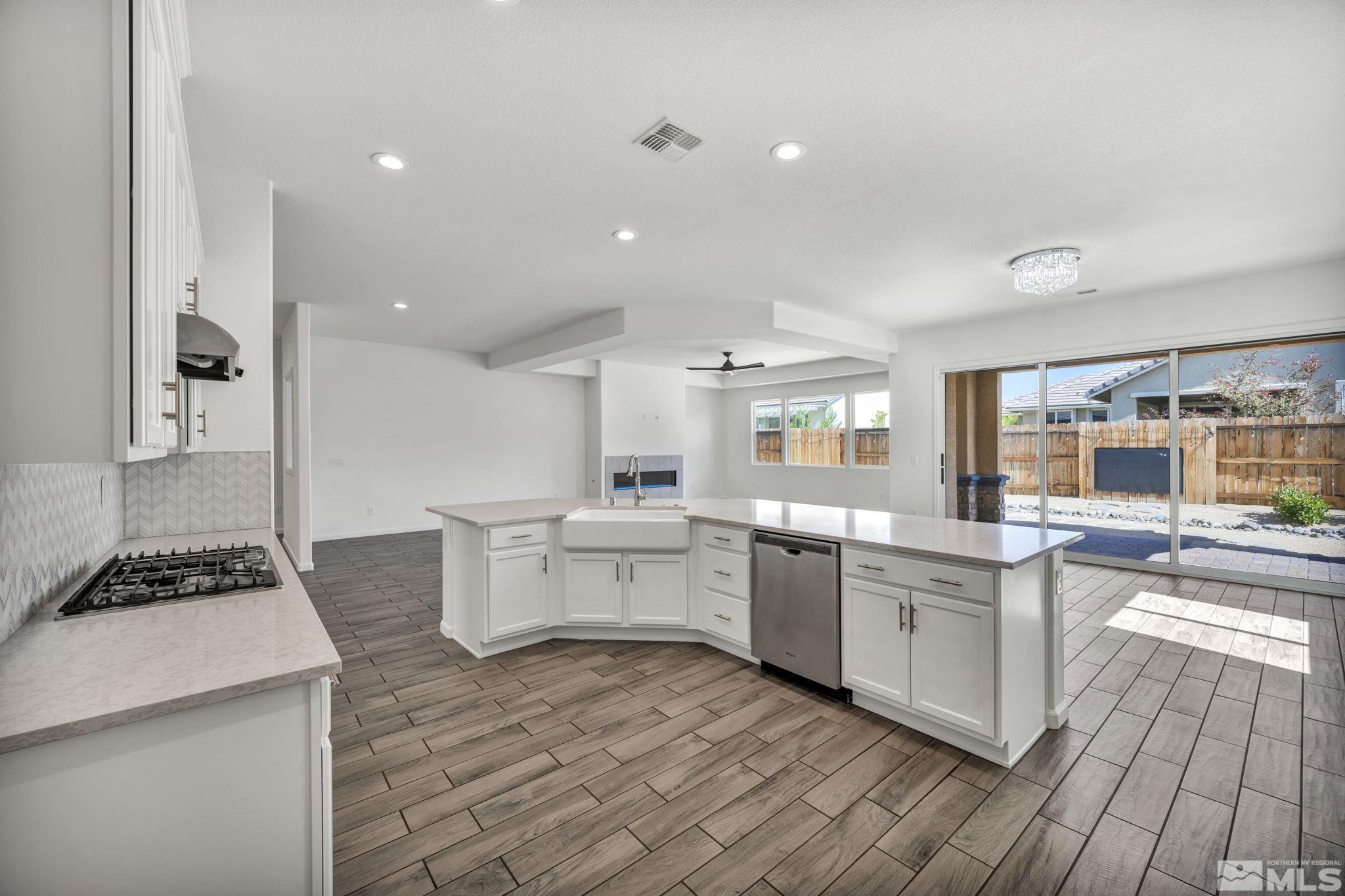 2013 Neviekay Lane Reno, NV 89521 - Photo 23 of 35 a kitchen with a sink and stove top oven
