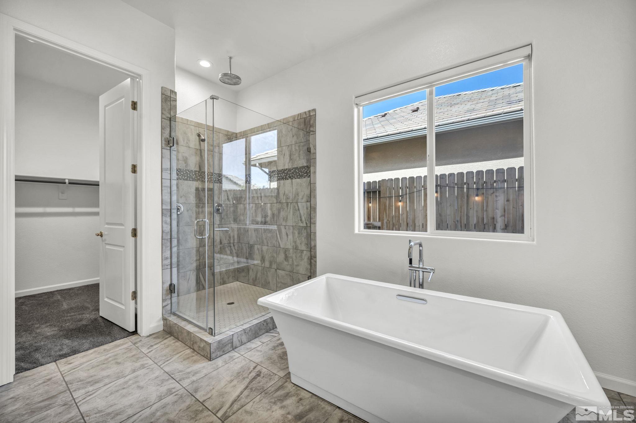 2013 Neviekay Lane Reno, NV 89521 - Photo 27 of 35 a bathroom with a bathtub and a shower