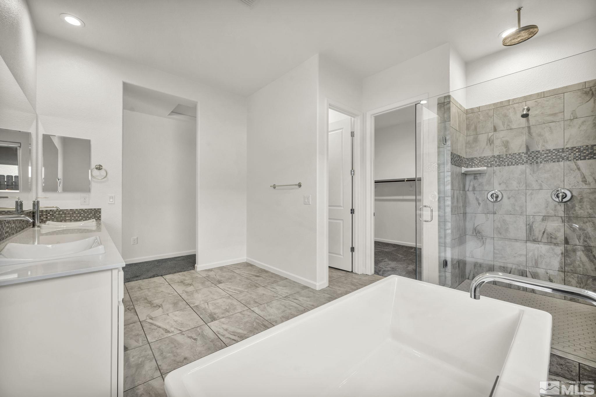 2013 Neviekay Lane Reno, NV 89521 - Photo 28 of 35 a spacious bathroom with a granite countertop sink a mirror and shower