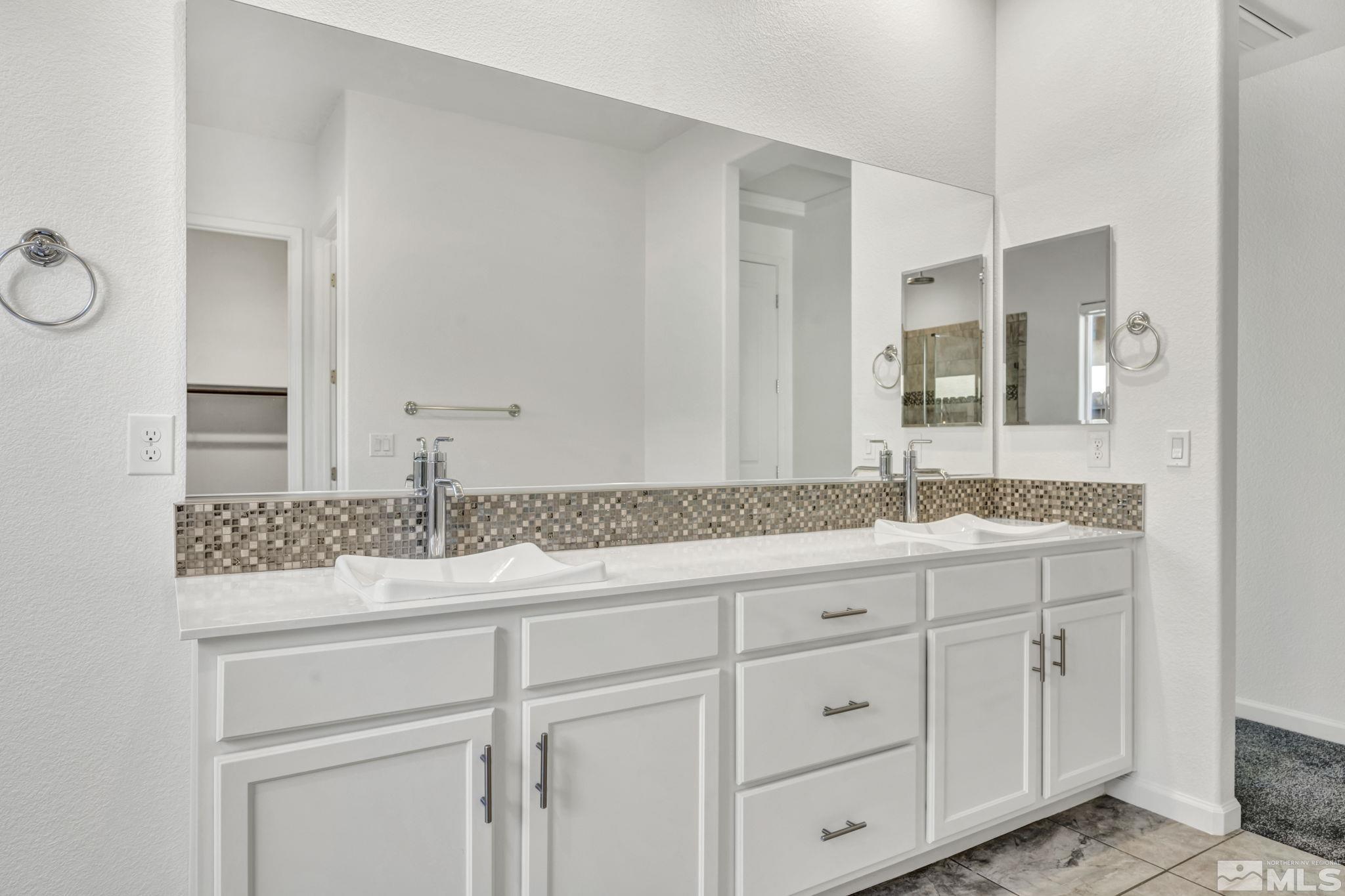 2013 Neviekay Lane Reno, NV 89521 - Photo 30 of 35 a bathroom with a granite countertop double vanity sink and mirror