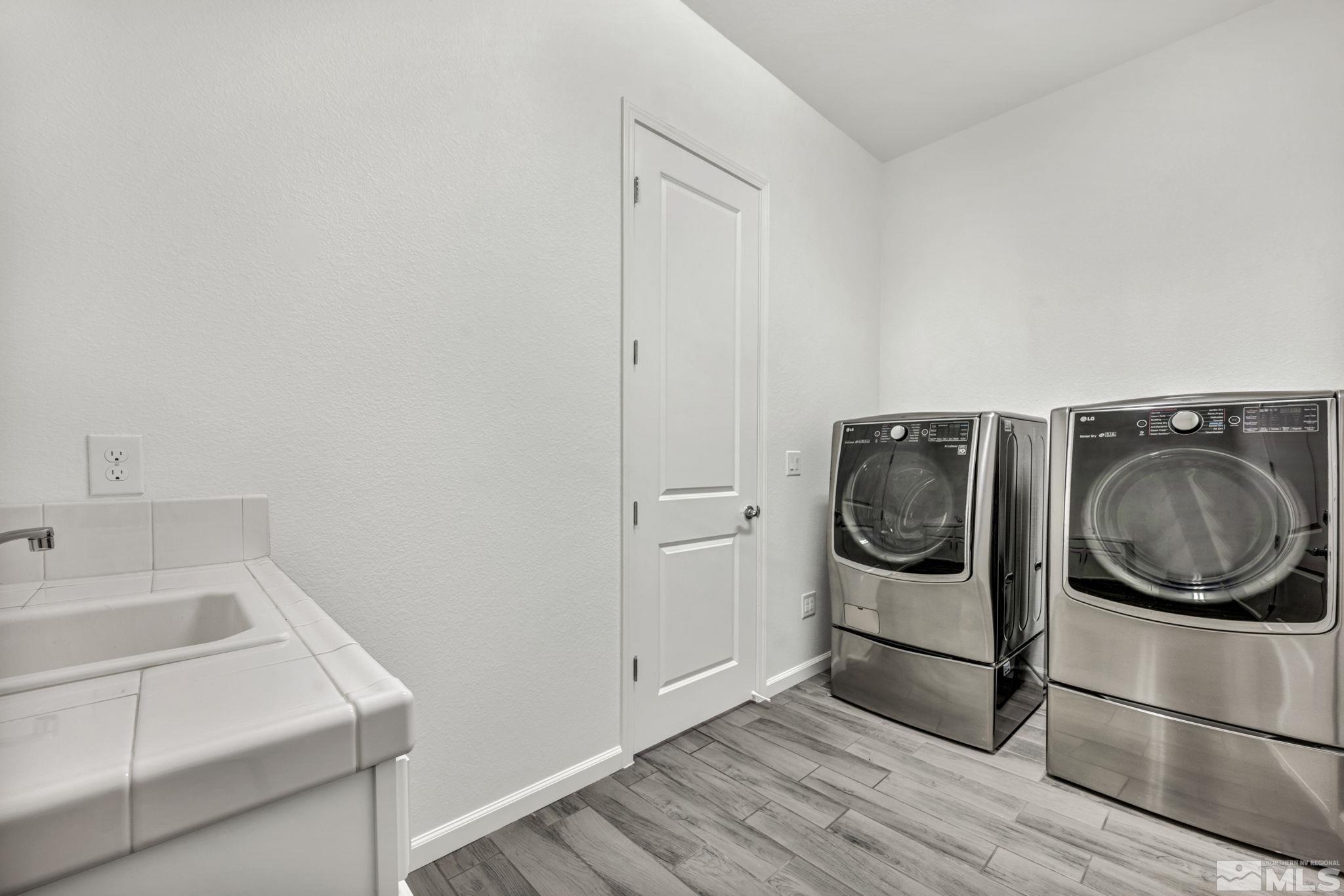 2013 Neviekay Lane Reno, NV 89521 - Photo 32 of 35 a utility room with sink dryer and washer