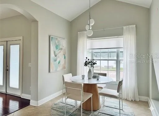 a dining room with furniture and window