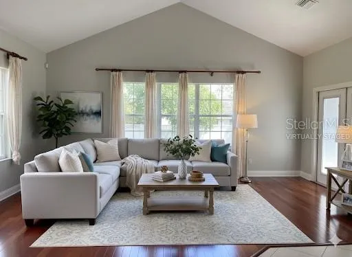 a living room with furniture and a large window