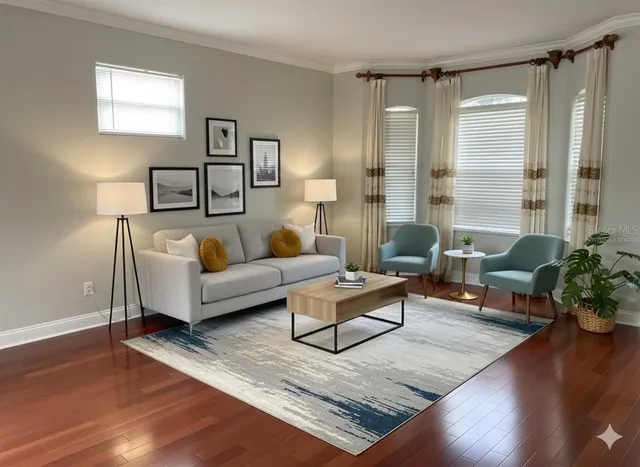 a living room with furniture and a large window