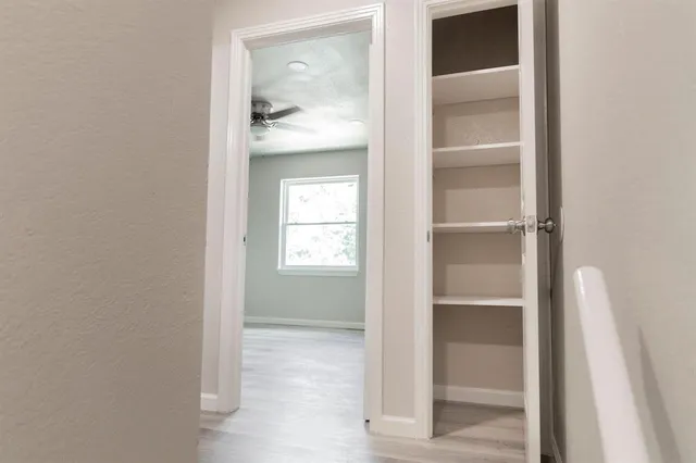 a view of an empty room with a window