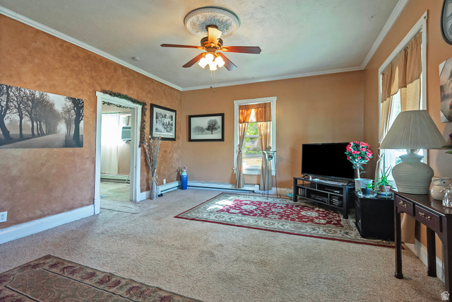 178 17th Street Ogden, UT 84404 - Photo 8 of 29 Spacious living area featuring neutral carpeting, warm wall tones, white crown molding, and a ceiling fan with integrated lighting