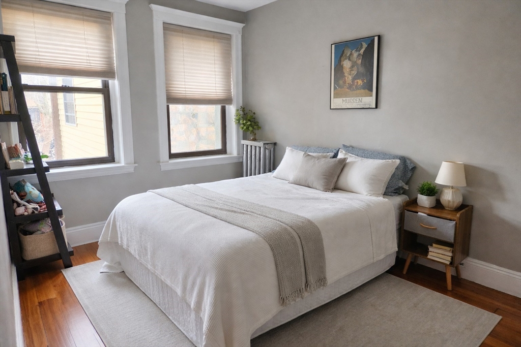 30 Claflin Road, Unit 2 Brookline, MA 02445 - Photo 6 of 10 a bedroom with a bed and a window