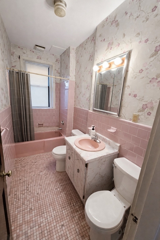 30 Claflin Road, Unit 2 Brookline, MA 02445 - Photo 10 of 10 a bathroom with a toilet sink and mirror