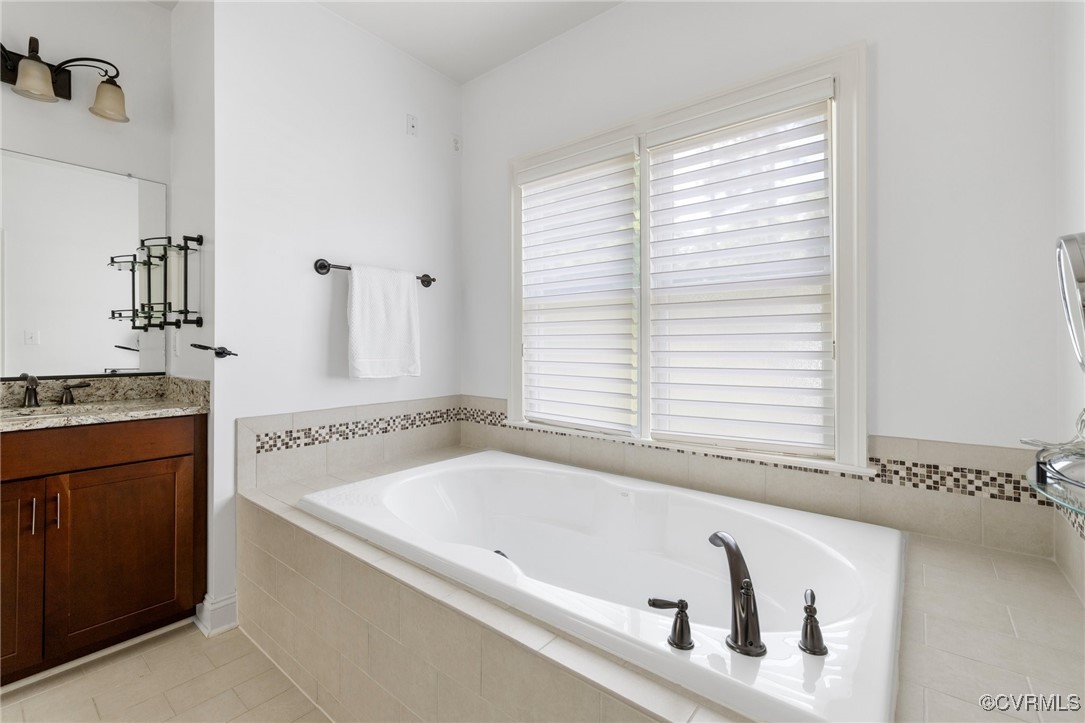 569 Raleigh Manor Road Henrico, VA 23229 - Photo 34 of 46 The Primary Bathroom with Soaking Tub and Dual Van