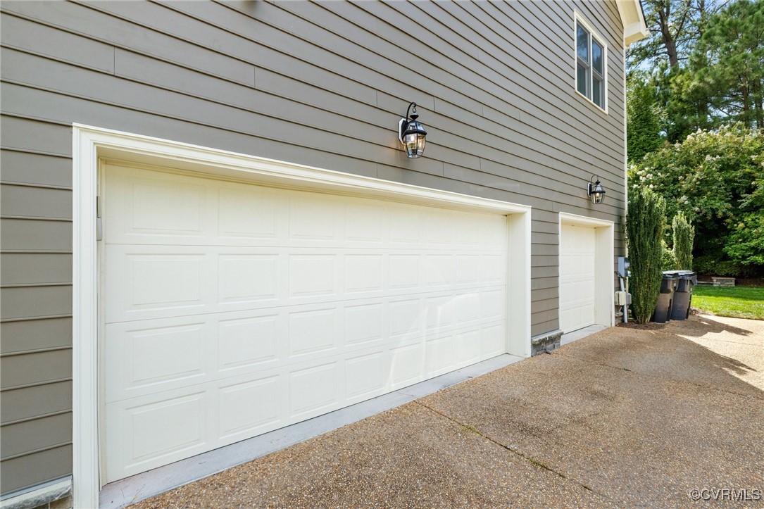 569 Raleigh Manor Road Henrico, VA 23229 - Photo 45 of 46 A Three car garage with storage cabinetry too.