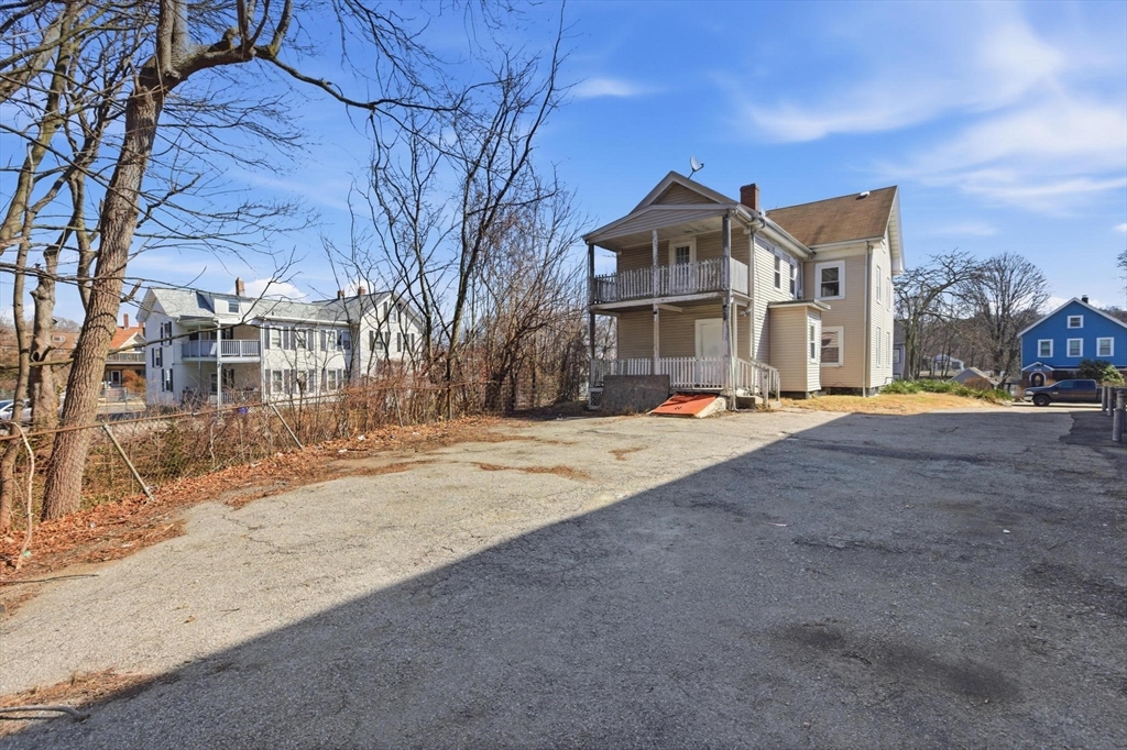1081 River Street Boston, MA 02136 - Photo 5 of 8 a street view with residential house