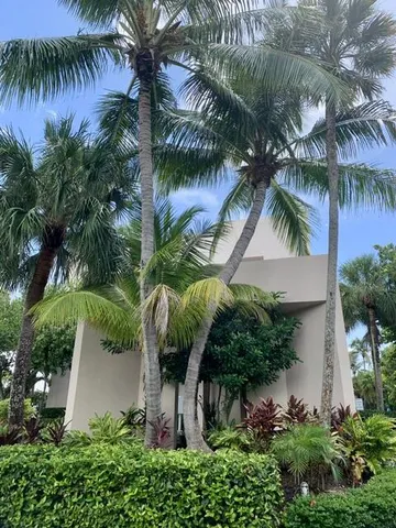 a view of a swimming pool with outdoor seating