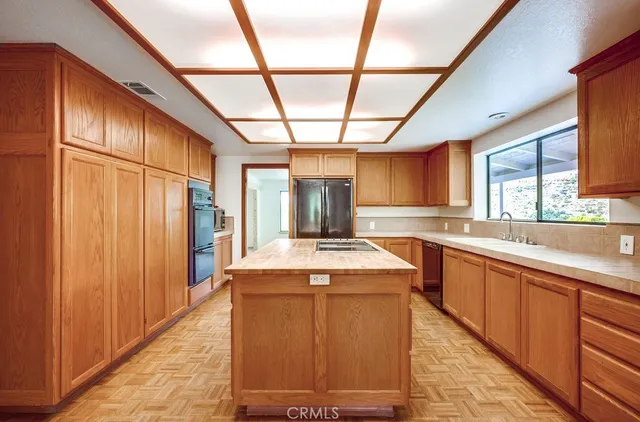 a room with a bed and a large window