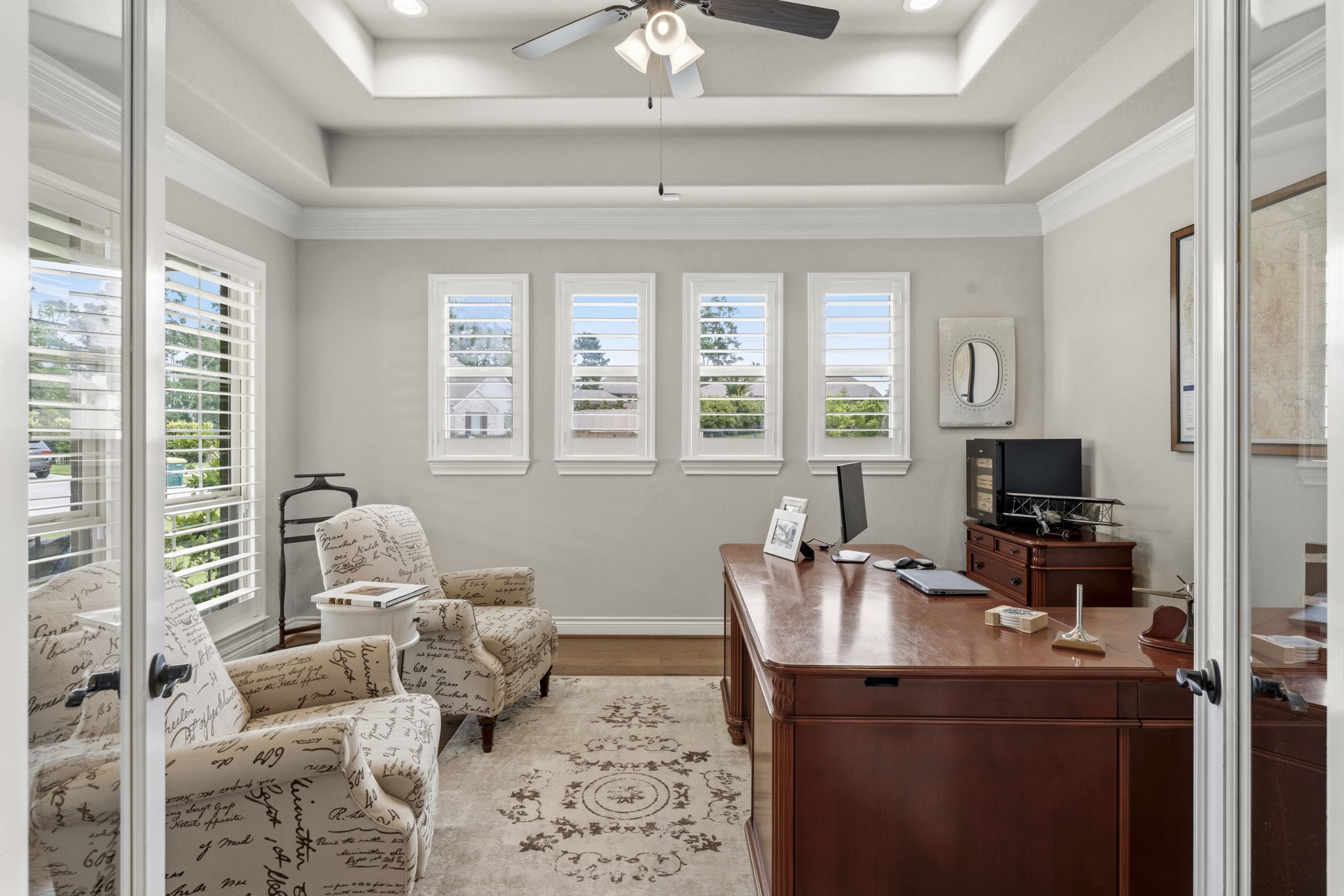 14012 Beartooth Bend Trail Conroe, TX 77384 - Photo 9 of 50 The private study is truly a standout space, showcasing sophisticated design details including a double tray ceiling, double crown molding, and six sunny windows with plantation shutters.