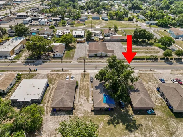 an aerial view of a houses with outdoor space