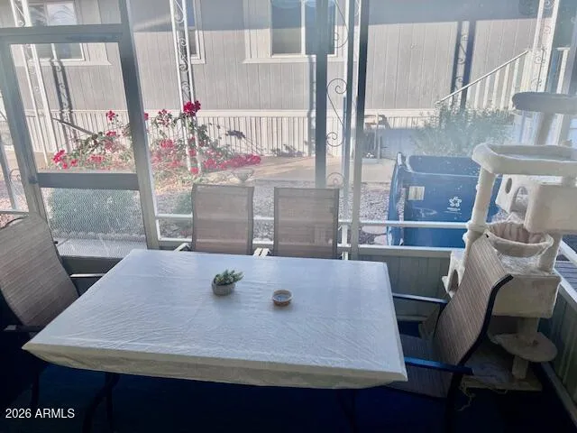 a view of table and chair in wooden floor