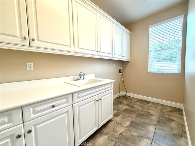 a view of a room with window and stairs