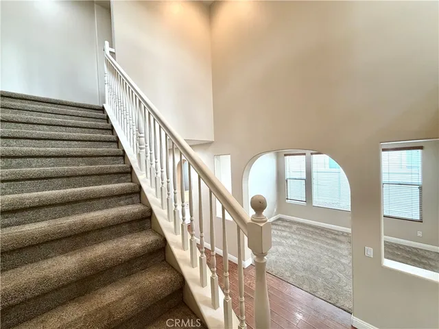 a bathroom with a toilet and a shower curtain