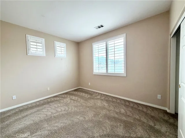 a large spacious bathroom with a large tub shower and sink
