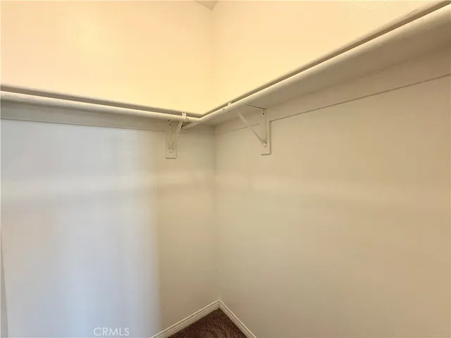 a spacious bathroom with a granite countertop sink mirror and