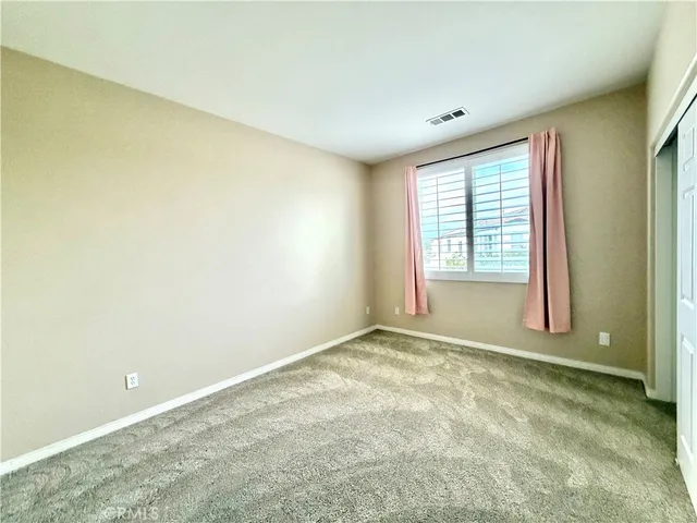 a large bathroom with a double vanity sink mirror and toilet