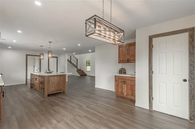 a view of kitchen with cabinets and wooden floor