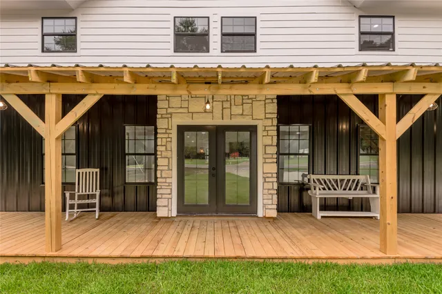 a view of a dinning room with brick wall and a window