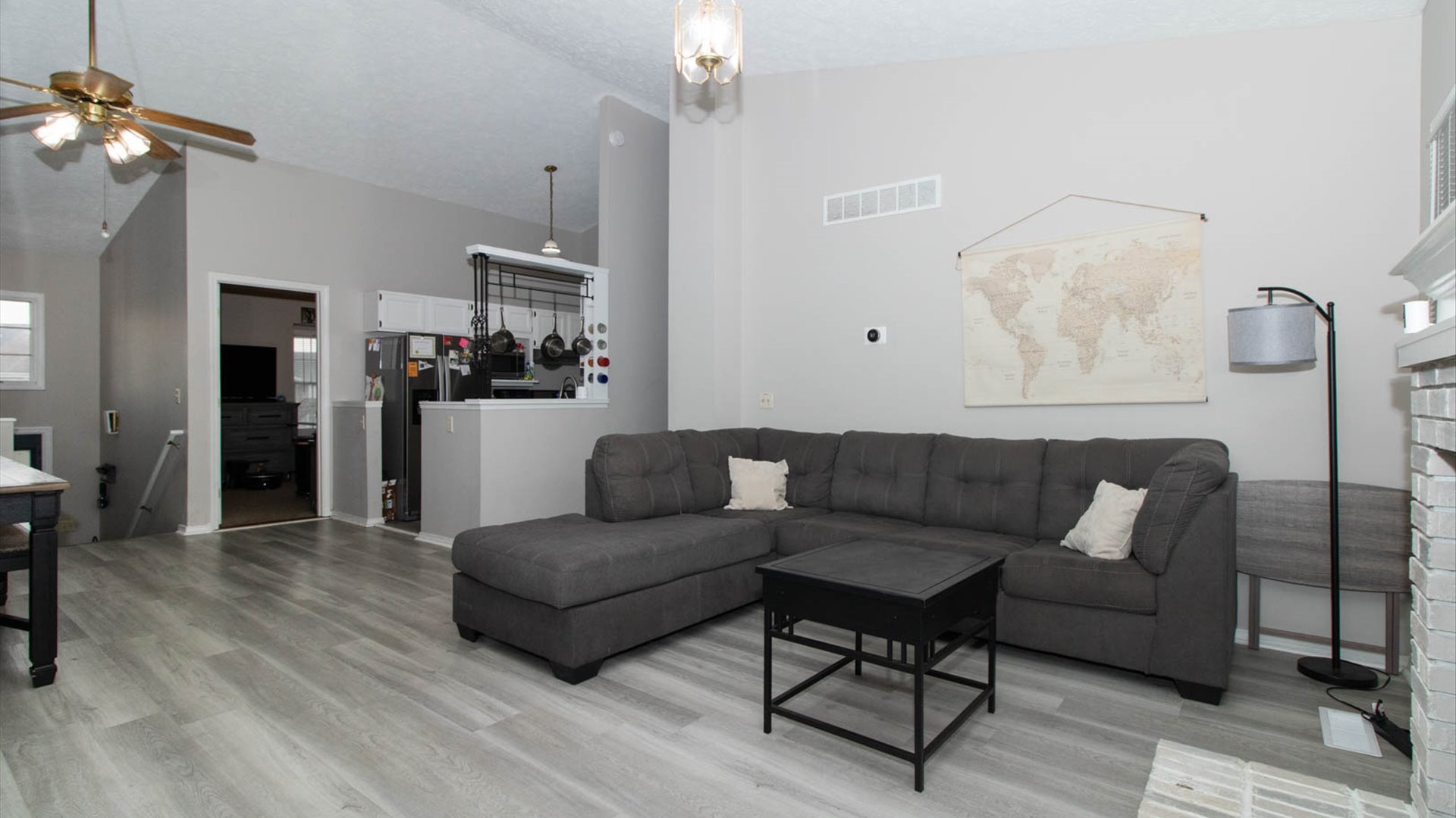 4 Shire Court Bloomington, IL 61701 - Photo 14 of 33 a living room with furniture and a chandelier