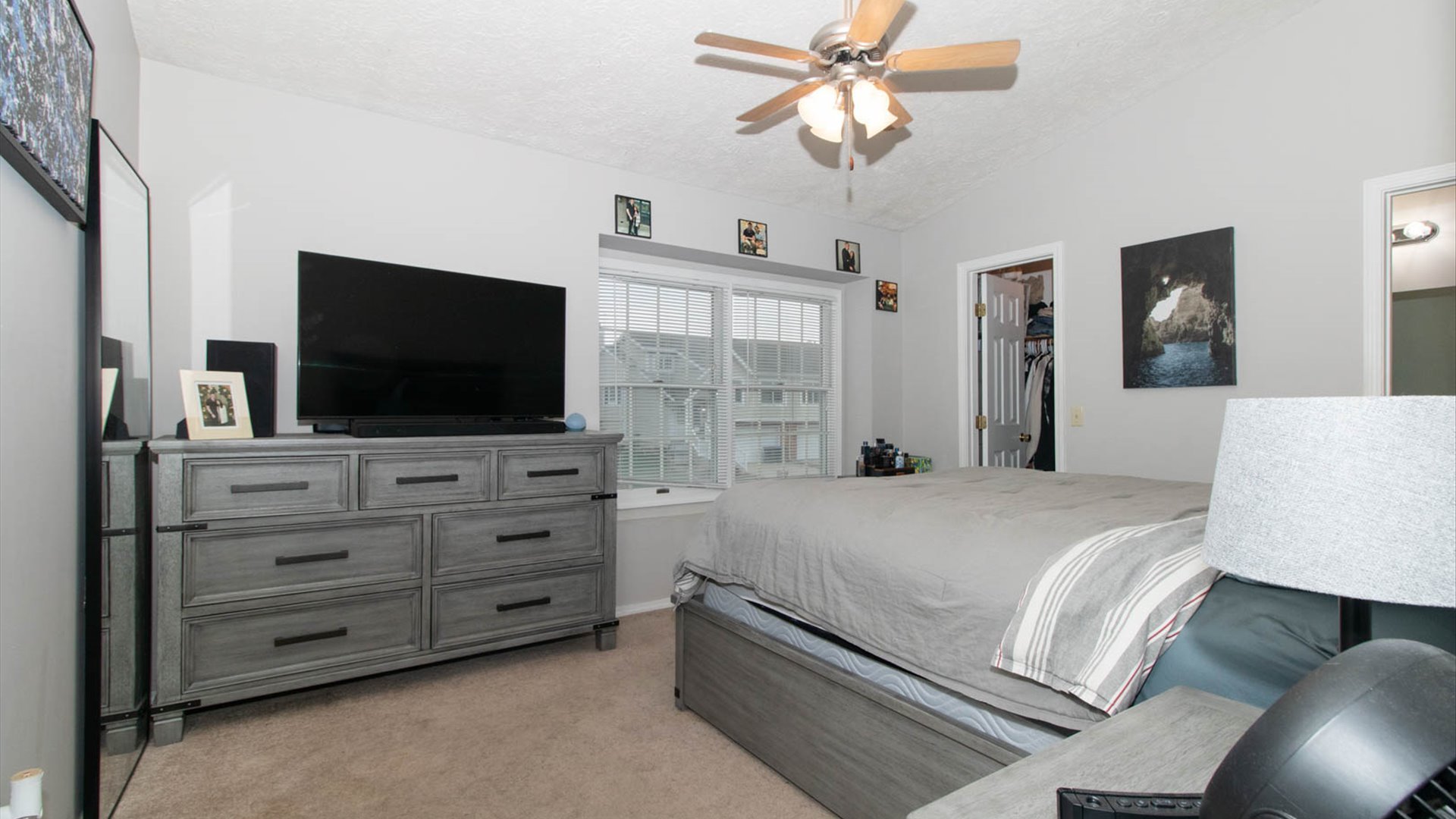 4 Shire Court Bloomington, IL 61701 - Photo 24 of 33 a bedroom with a bed and a flat screen tv