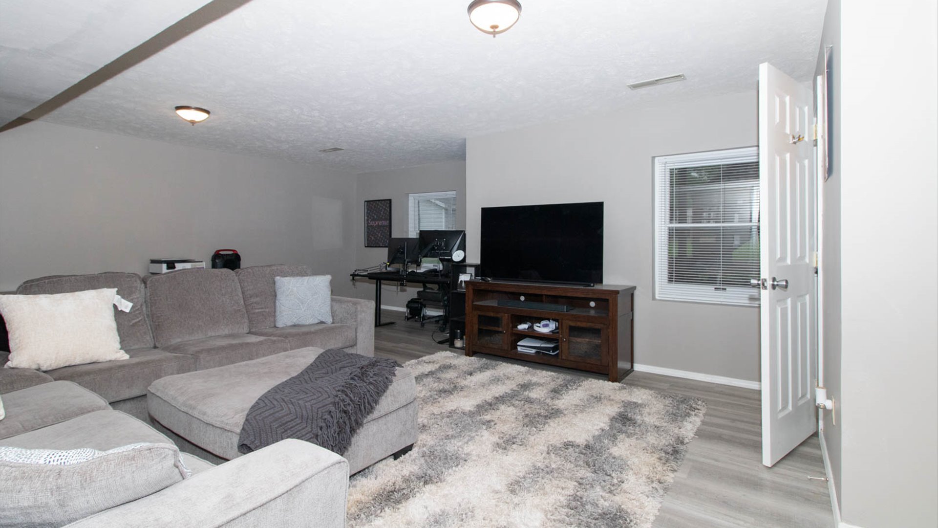 4 Shire Court Bloomington, IL 61701 - Photo 3 of 33 a living room with furniture and a flat screen tv