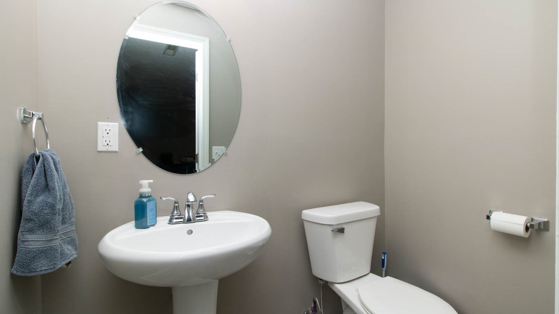 4 Shire Court Bloomington, IL 61701 - Photo 8 of 33 a bathroom with a toilet sink and mirror