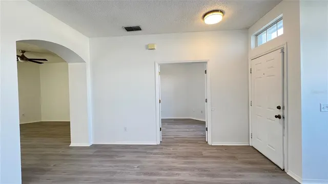 wooden floor in a hall with an entryway