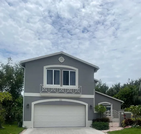 a front view of a house with yard