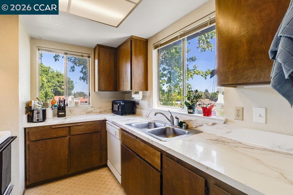 1123 Chadwick Circle Bay Point, CA 94565 - Photo 12 of 26 a kitchen with a sink stove and microwave