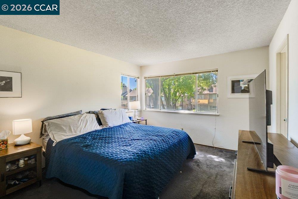 1123 Chadwick Circle Bay Point, CA 94565 - Photo 18 of 26 a bedroom with a bed and window