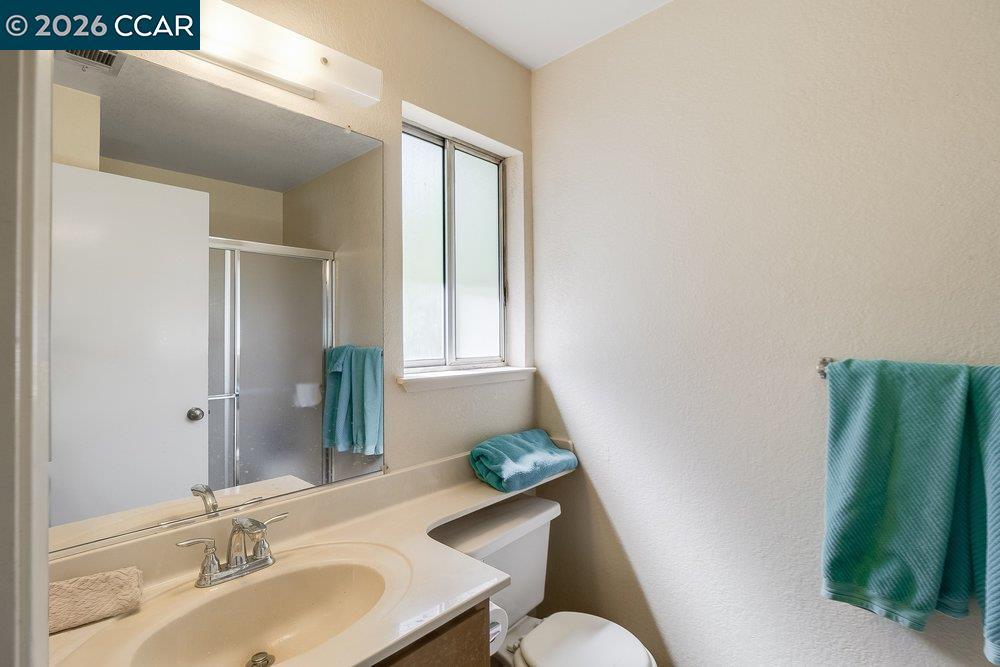 1123 Chadwick Circle Bay Point, CA 94565 - Photo 20 of 26 a bathroom with a sink and a mirror