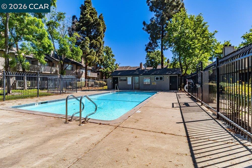 1123 Chadwick Circle Bay Point, CA 94565 - Photo 25 of 26 a view of a swimming pool with a lounge chairs