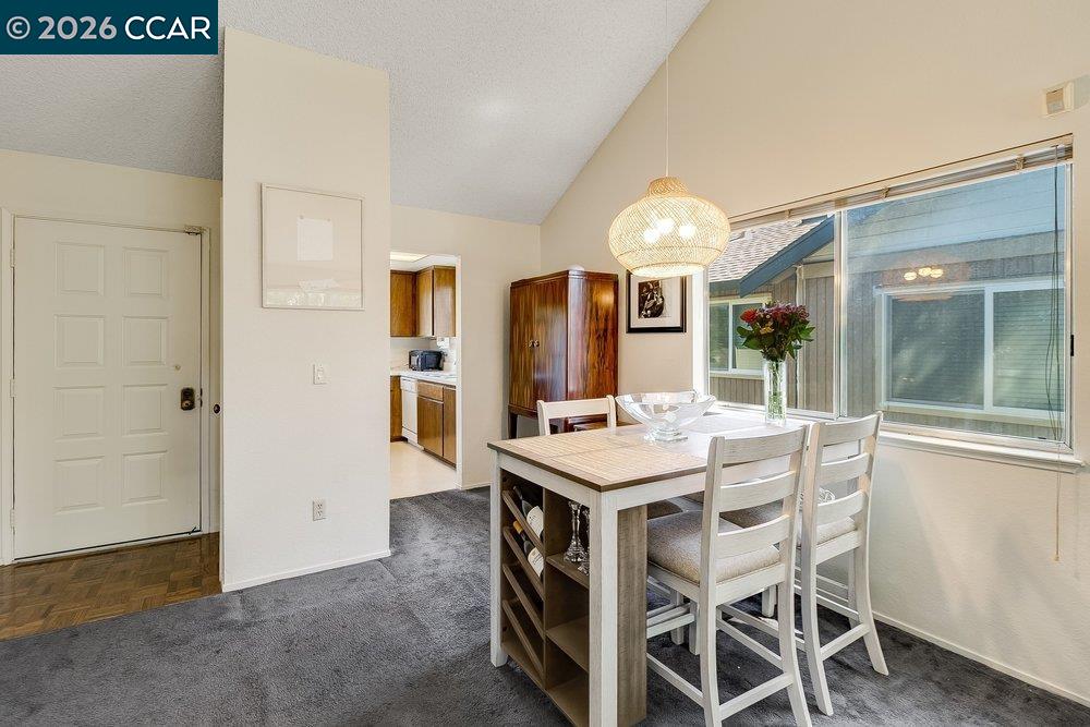 1123 Chadwick Circle Bay Point, CA 94565 - Photo 10 of 26 a view of a dining room with furniture and a chandelier