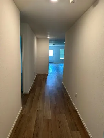 a view of a livingroom with wooden floor