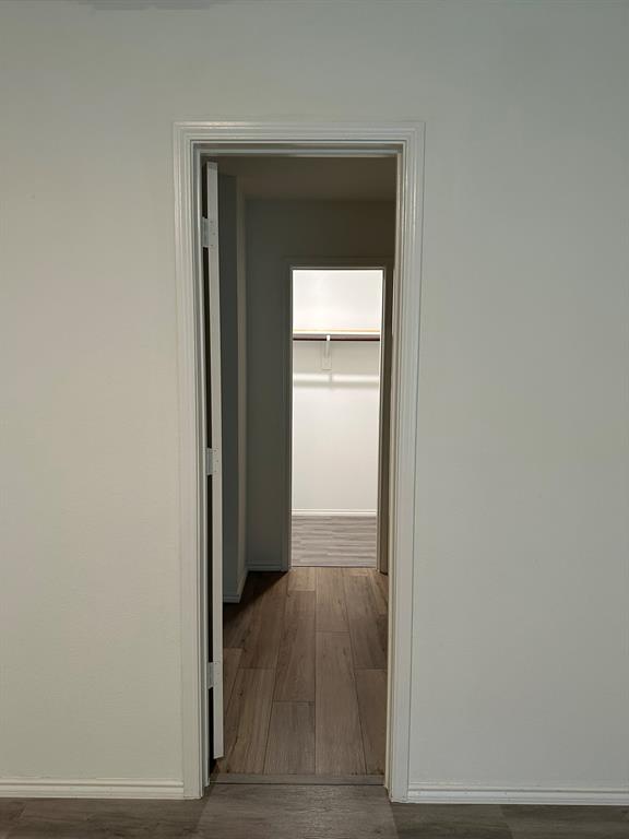 5906 Nyquist Way Forney, TX 75126 - Photo 20 of 27 a view of a hallway with wooden floor