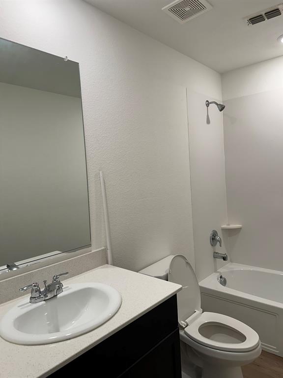 5906 Nyquist Way Forney, TX 75126 - Photo 7 of 27 a bathroom with a sink a toilet and shower