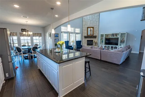a living room with fireplace furniture and a flat screen tv