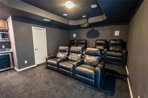 a media room with lots of chairs and a projector