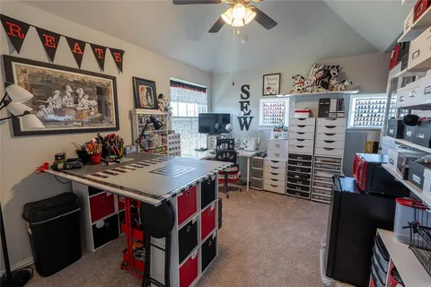 a utility room with stainless steel appliances kitchen island granite countertop a stove and a refrigerator
