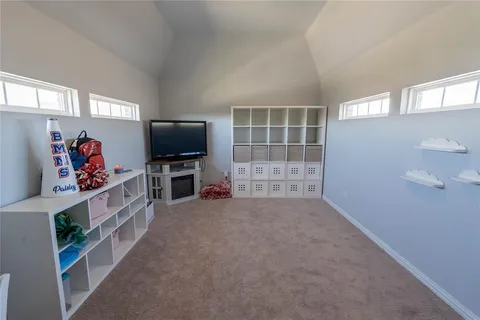 a view of a livingroom with furniture and a window