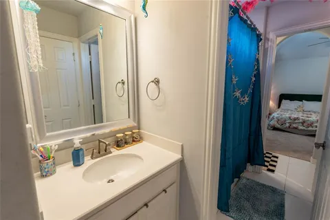 a bathroom with a sink and a mirror